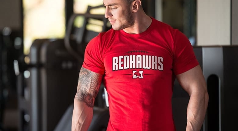 Brands man in red tshirt in gym