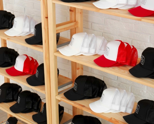 A rack of custom promotional hats