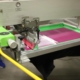 A screen printing machine preparing custom ink