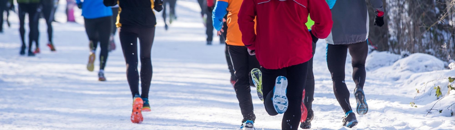 Runners participating in a marathon in the snow
