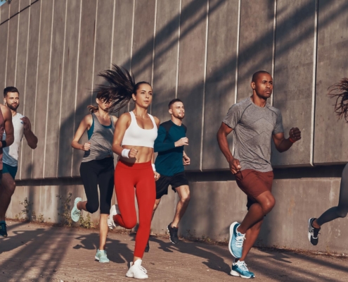 Athletes jogging down the street